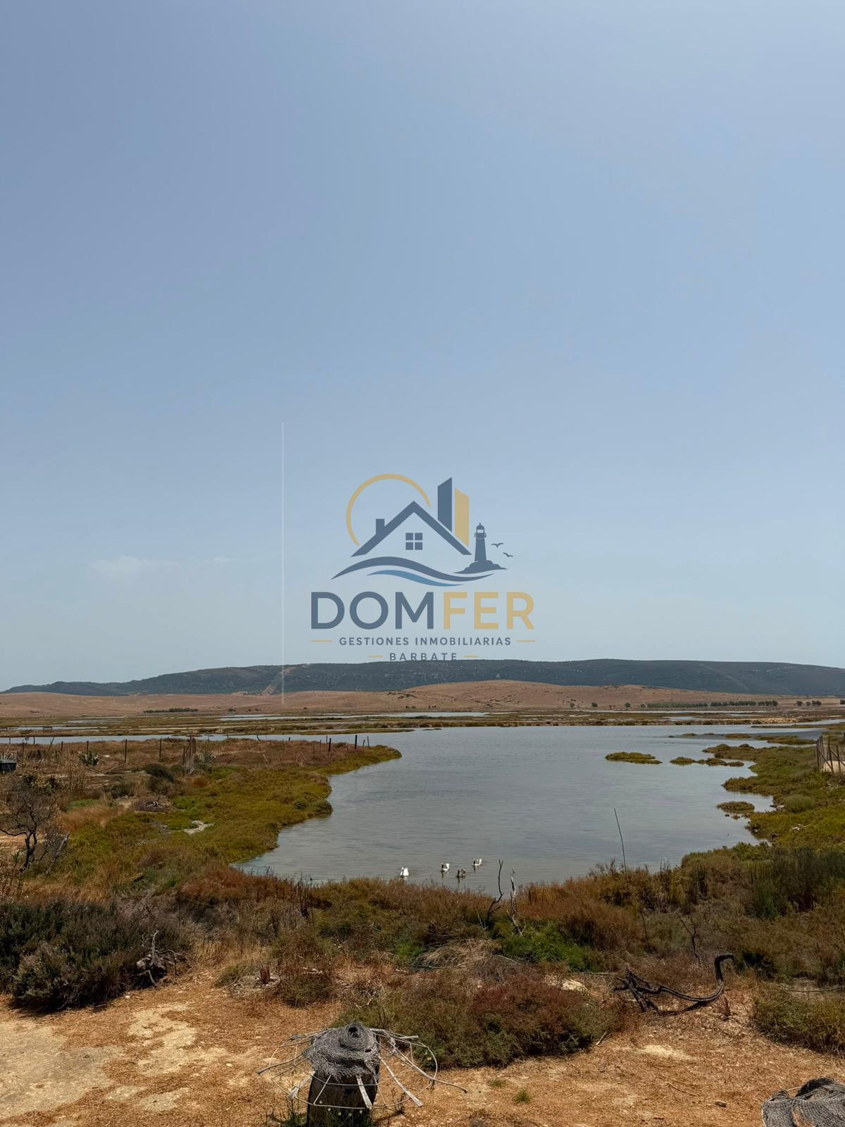 Una joya natural en la Costa de la Luz: Parcela única con vistas al mar y las marismas